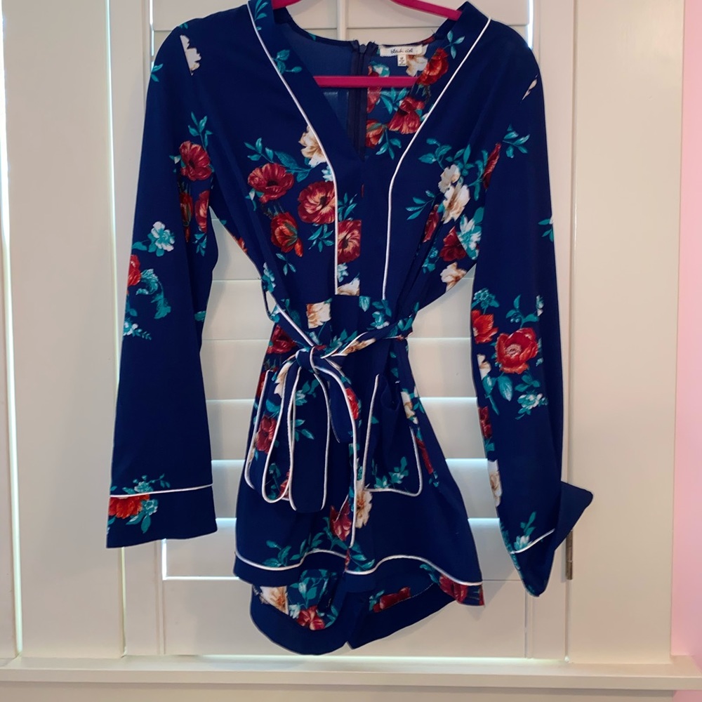 Blue long sleeve romper with floral pattern
